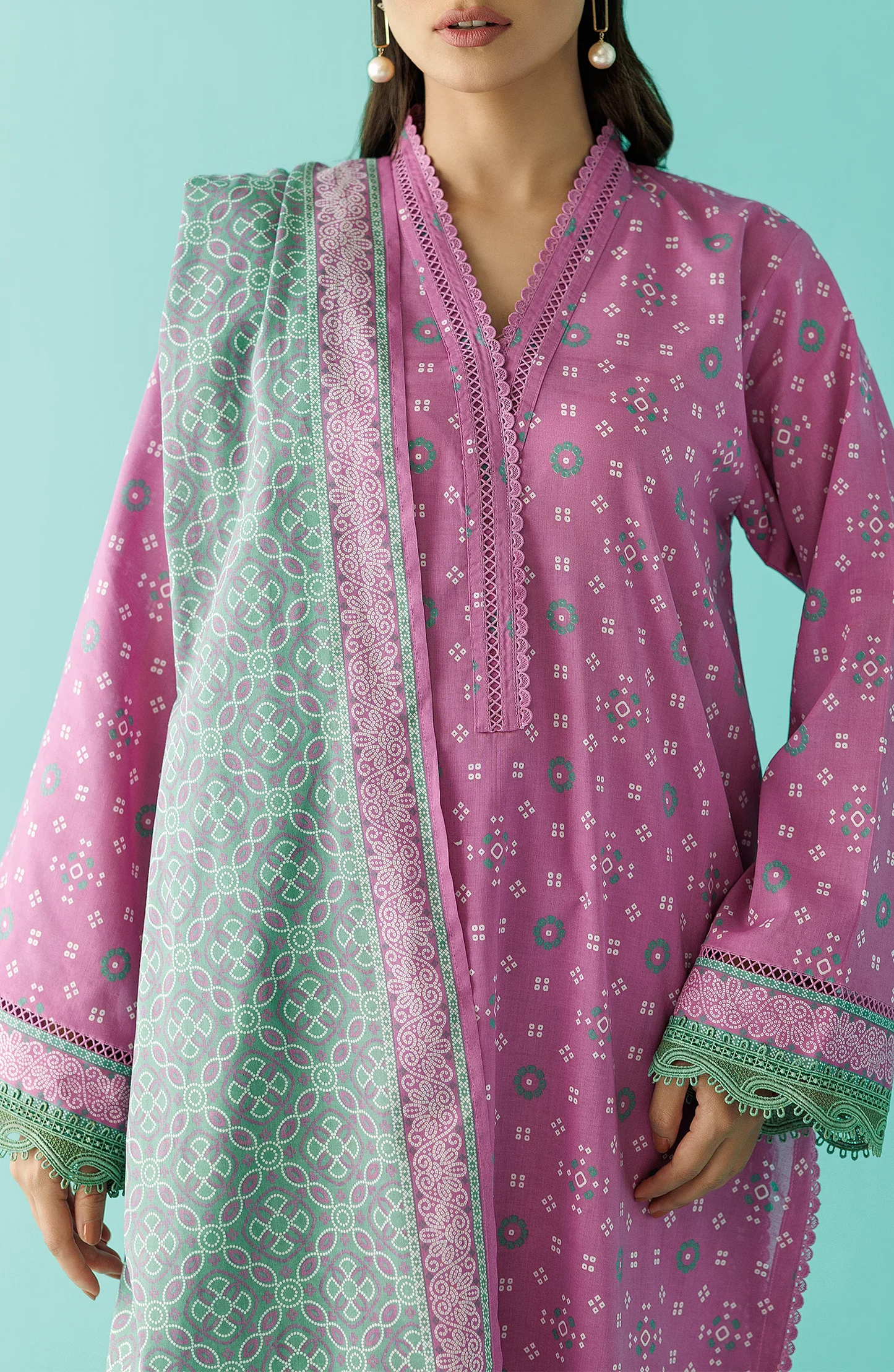 Woman wearing a pink traditional outfit with a green dupatta with a plain traditional trouser. Unstitched Printed Lawn Shirt Dupatta & Pant - 3 Piece Suits - OTL-20015