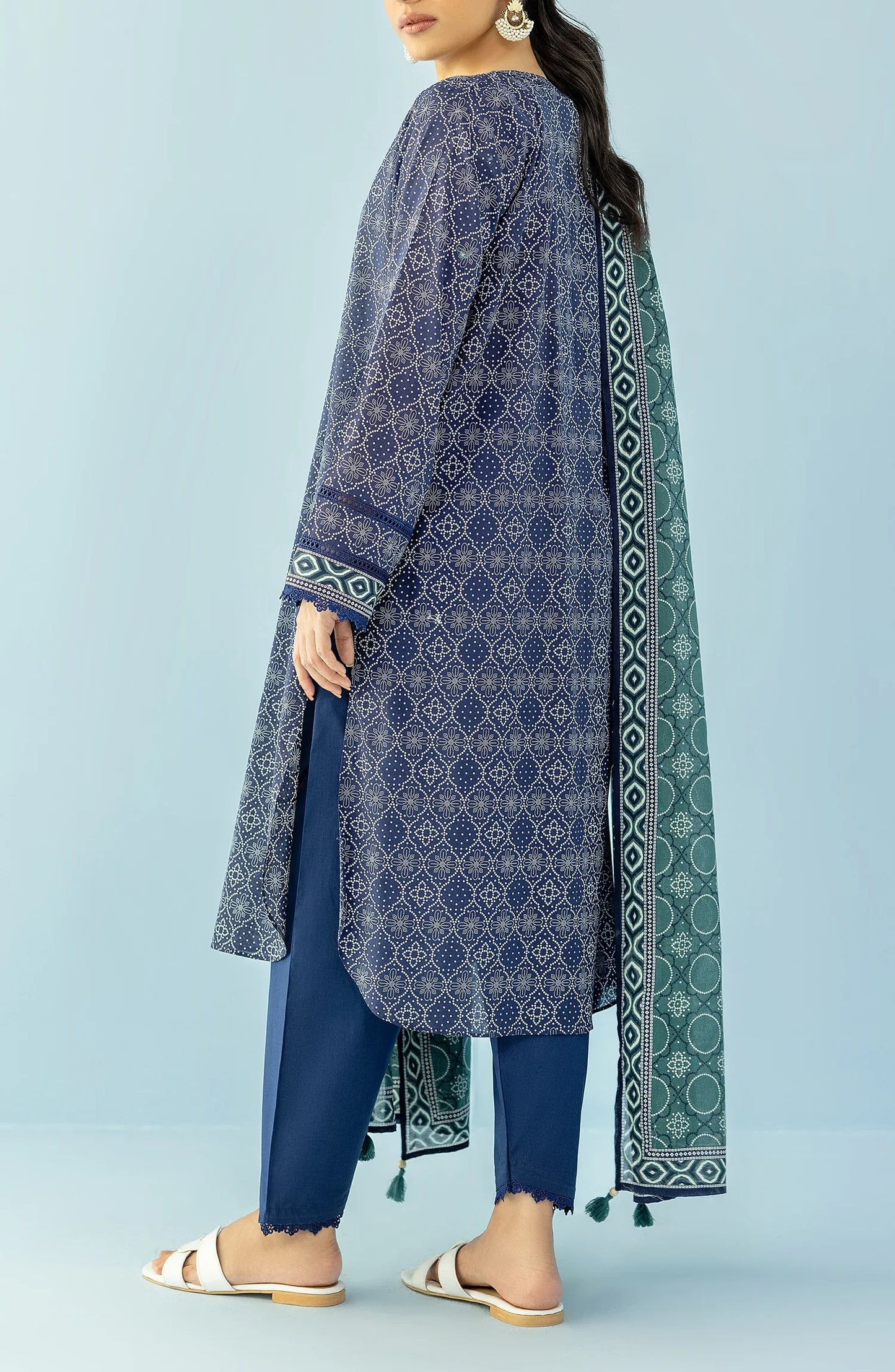 Woman wearing a navy blue patterned kurta with blue pants and a green dupatta on a blue trouser. Unstitched Printed Lawn Shirt Dupatta & Pant - 3 Piece Suits - OTL-20125