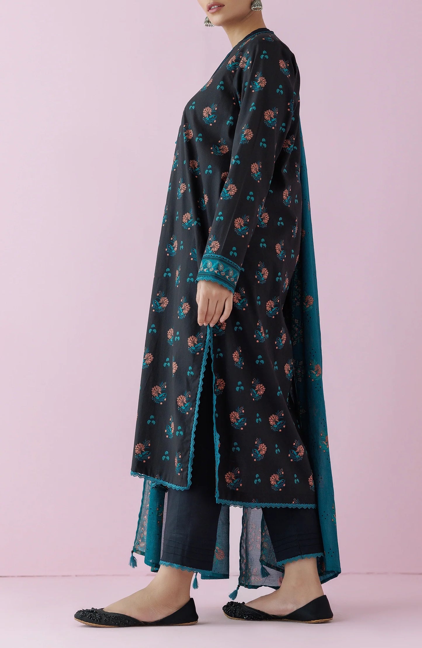 Woman wearing a black floral dress with a teal dupatta on a plain black trouser. Unstitched Printed Lawn Shirt Dupatta & Pant - 3 Piece Suits - OTL-20155