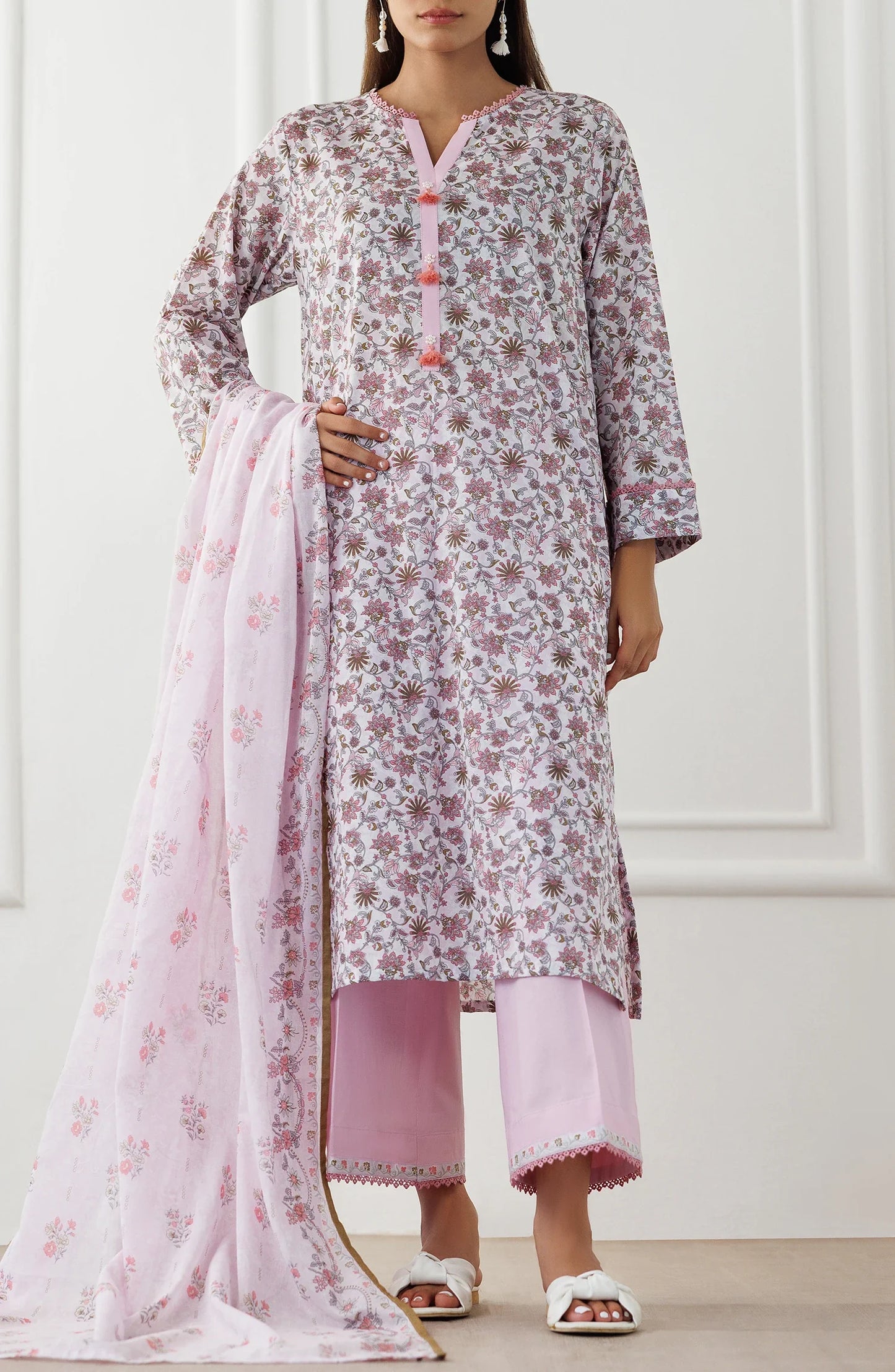 Woman wearing a floral kurta with pink pants and matching dupatta with a traditional shalwar. UNSTITCHED Printed Lawn Shirt Dupatta & Pant - 3 Piece Suits - OTL-25-021