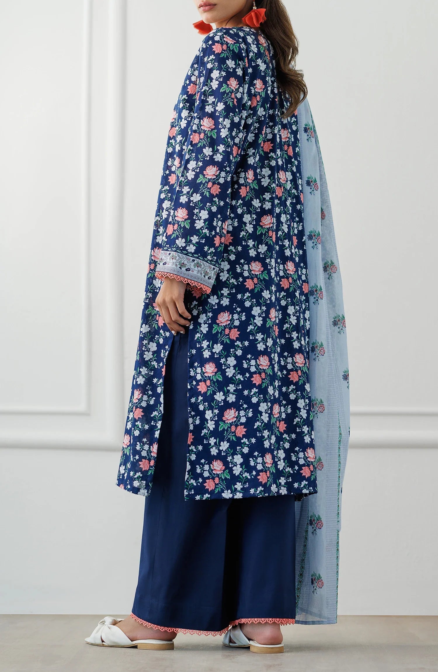 Woman wearing a blue floral kurta with matching pants and a light blue dupatta with dyed trouser. Unstitched Printed Lawn Shirt Dupatta & Pant - 3 Piece Suits - OTL-25-028