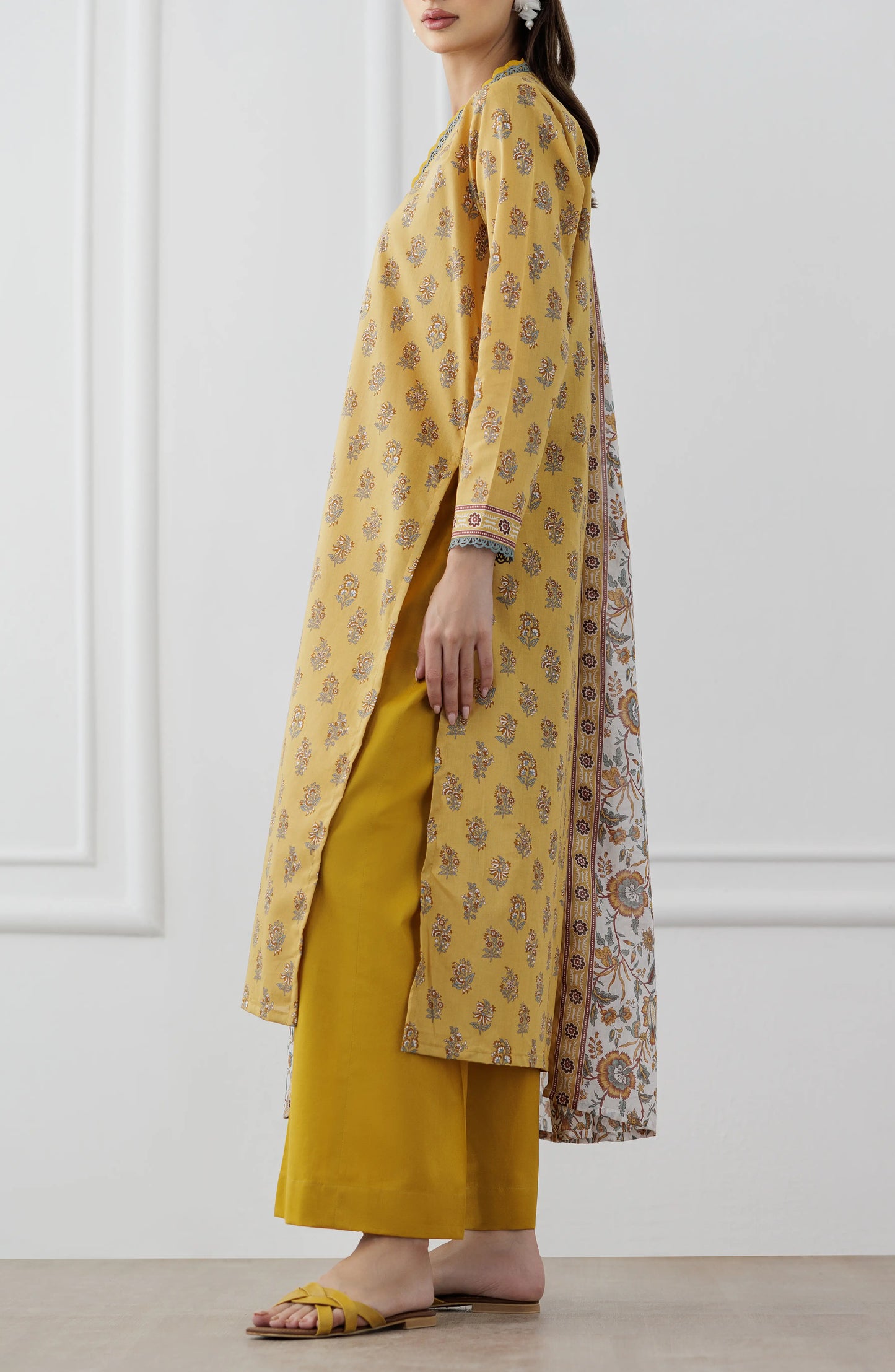 Woman wearing a mustard yellow kurta with a floral dupatta against a dyed trouser. Unstitched Printed Lawn Shirt Dupatta & Pant - 3 Piece Suits - OTL-25-118