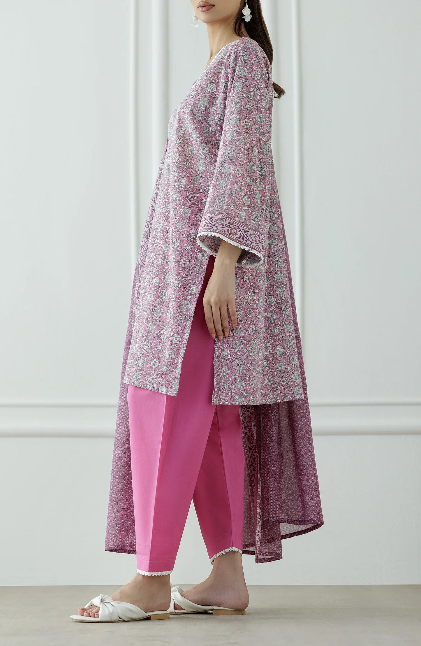Woman wearing a pink traditional outfit with a matching dupatta against a matching traditional shalwar. Stitched Printed Lawn Shirt Dupatta & Pant - 3 Piece - OTL-25-309.