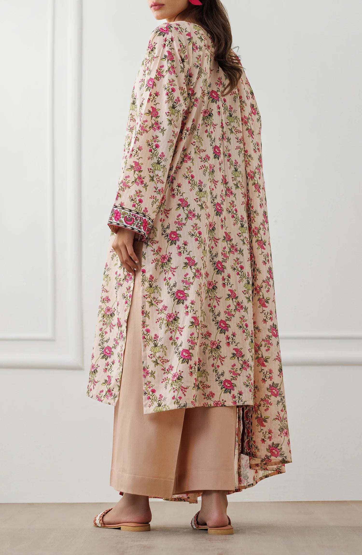 Woman wearing a floral dress with a matching dupatta against a matching trouser. Unstitched Printed Lawn Shirt Dupatta & Pant - 3 Piece Suits - OTL-25-319