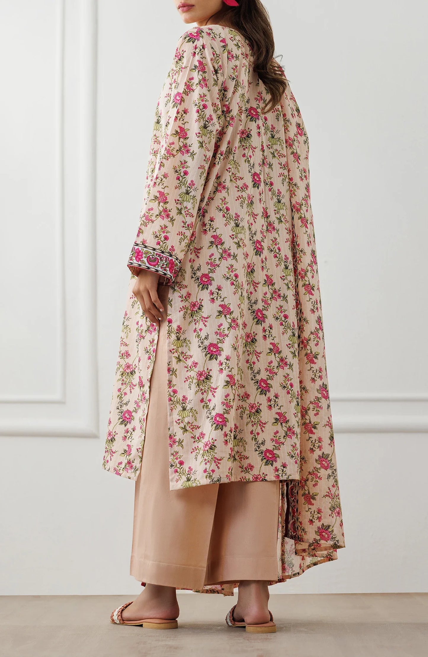 Woman wearing a floral dress with a matching dupatta against a matching trouser. Unstitched Printed Lawn Shirt Dupatta & Pant - 3 Piece Suits - OTL-25-319