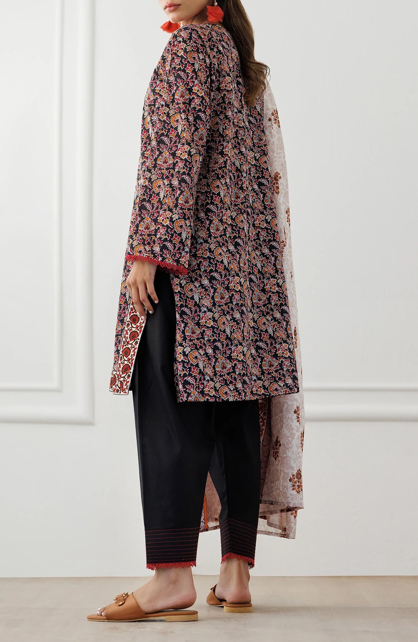 Woman wearing a floral kurta with a matching dupatta on a black dyed shalwar. Unstitched Printed Lawn Shirt Dupatta & Pant - 3 Piece Suits - OTL-25-348