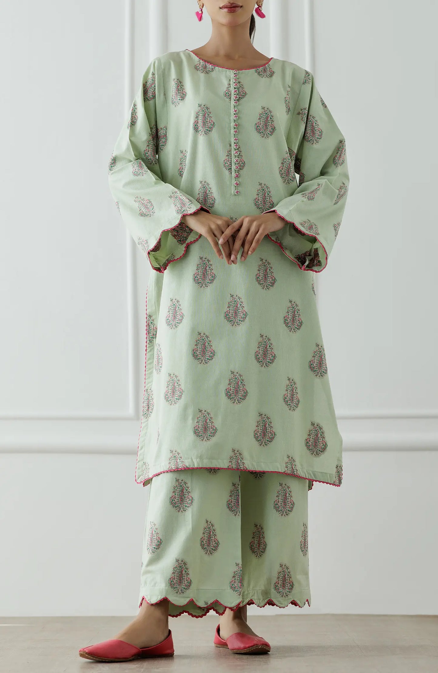 Stitched Dyed embroidered Lawn Jacquard Shirt & Pant - 2 Piece (CordSet) - WRHJ25S-2002. Light green dress with floral patterns and ruffled sleeves on a printed bottom.