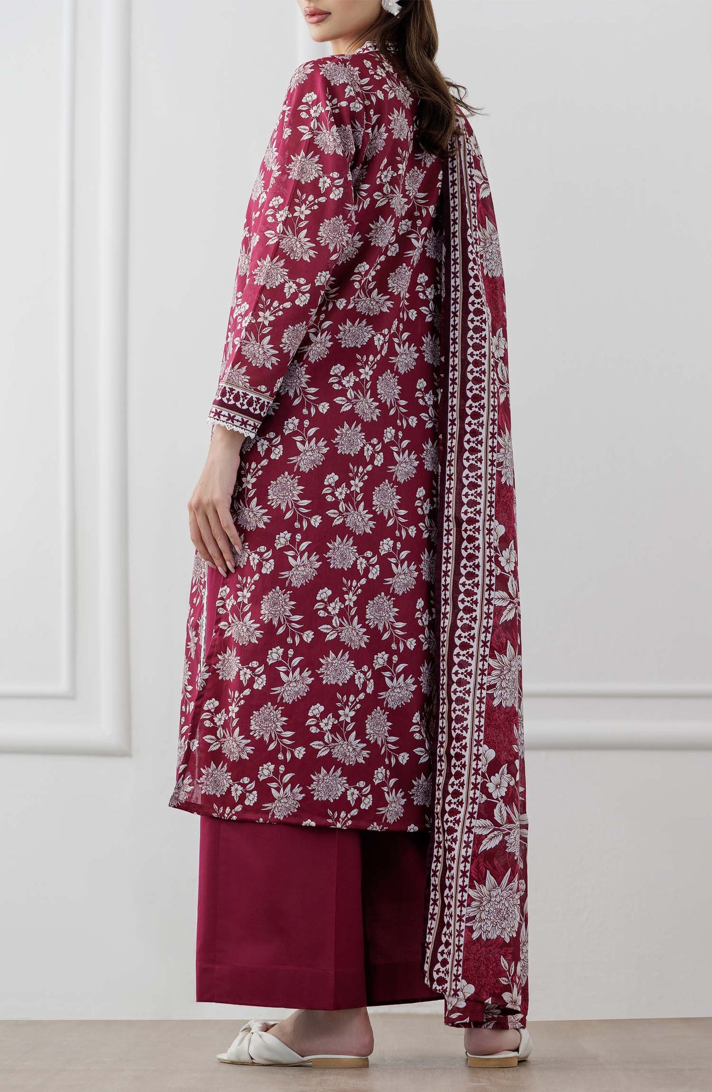 UNSTITCHED Printed Lawn Shirt Dupatta & Pant - 3 Piece Suits - OTL-25-060. Woman wearing a maroon floral dress with white patterns with printed dupatta on a plain trouser.