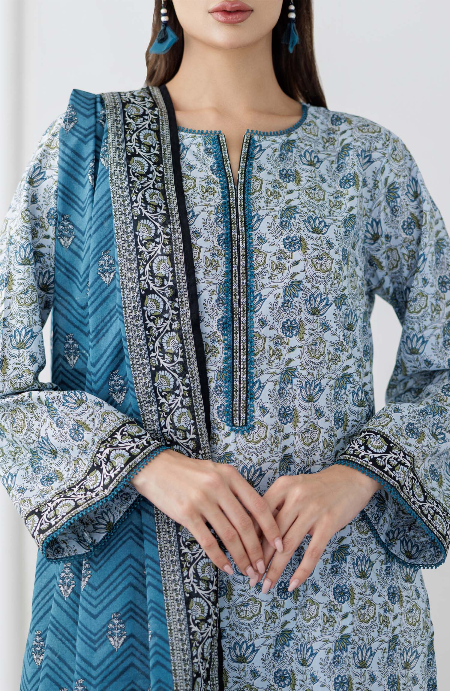 UNSTITCHED Printed Lawn Shirt Dupatta & Pant - 3 Piece Suits - OTL-25-347. Woman wearing a blue and white patterned kurta with a matching dupatta and dyed trouser.