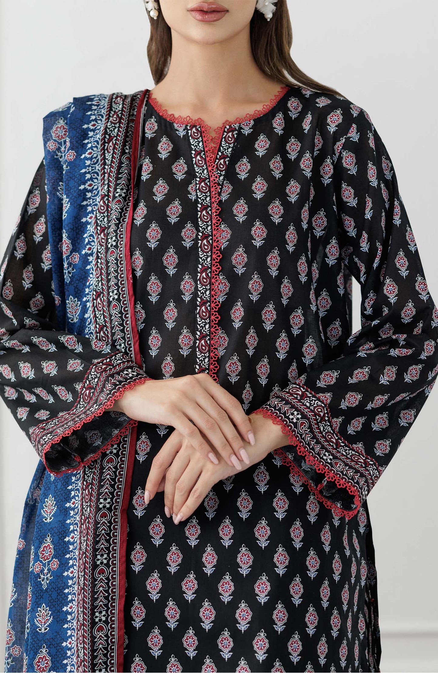 UNSTITCHED Printed Lawn Shirt Dupatta & Pant - 3 Piece Suits - OTL-25-048. Woman wearing a black and white patterned kurta with a blue printed dupatta against a plain trouser.