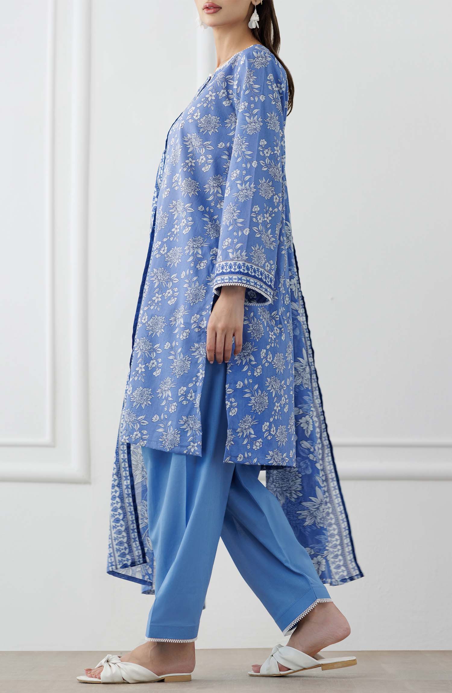 UNSTITCHED Printed Lawn Shirt Dupatta & Pant - 3 Piece Suits - OTL-25-338. Woman wearing a blue floral outfit with a matching dupatta and dyed trouser.