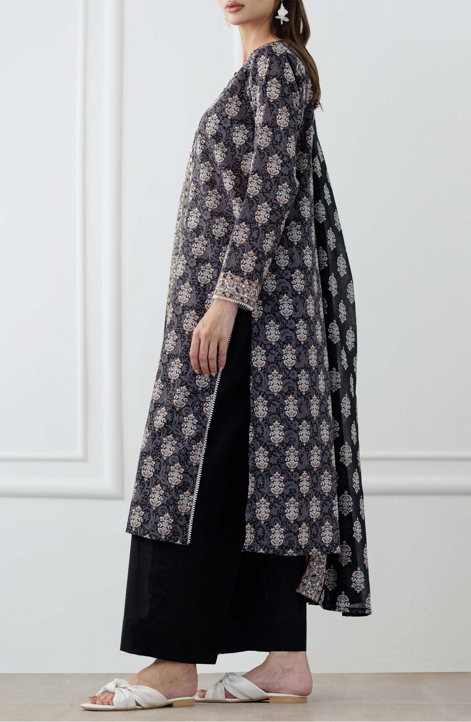 UNSTITCHED Printed Lawn Shirt Dupatta & Pant - 3 Piece Suits - OTL-25-105. Woman wearing a black and white patterned kurta with a matching dupatta in a minimalistic setting and plain trouser.
