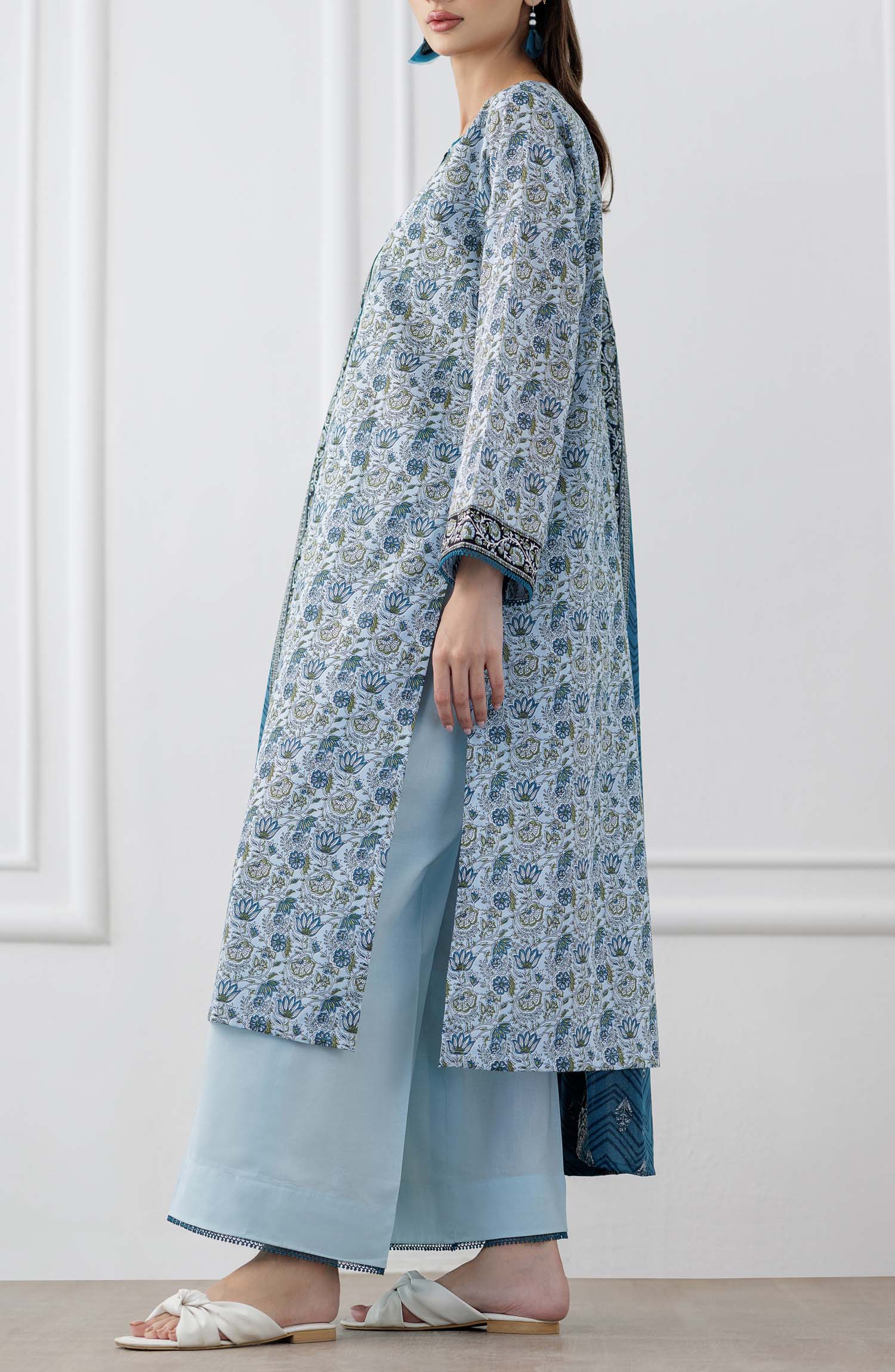 UNSTITCHED Printed Lawn Shirt Dupatta & Pant - 3 Piece Suits - OTL-25-347. Woman wearing a blue and white patterned kurta with a matching dupatta and dyed trouser.