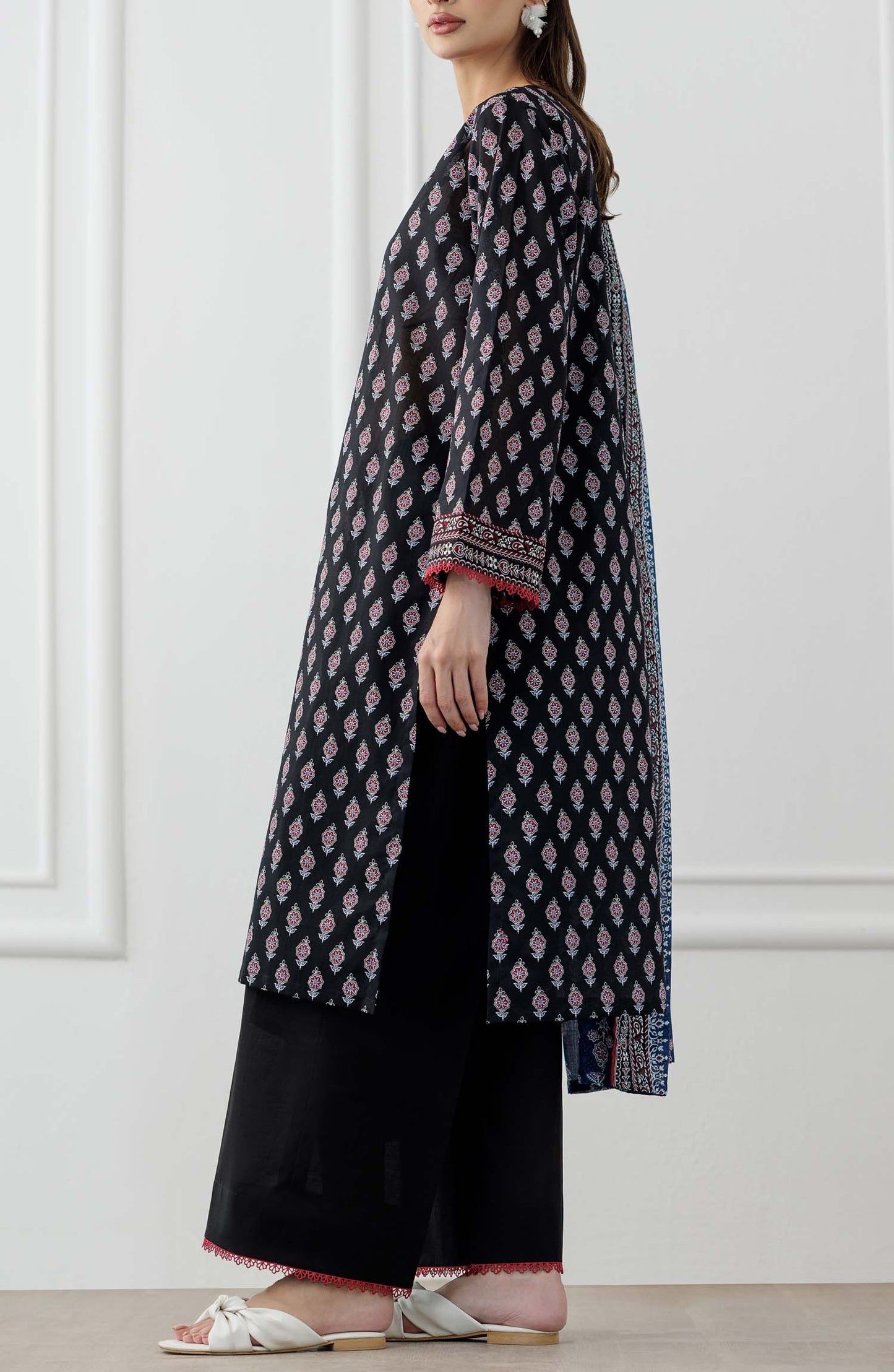 UNSTITCHED Printed Lawn Shirt Dupatta & Pant - 3 Piece Suits - OTL-25-048. Woman wearing a black and white patterned kurta with a blue printed dupatta against a plain trouser.