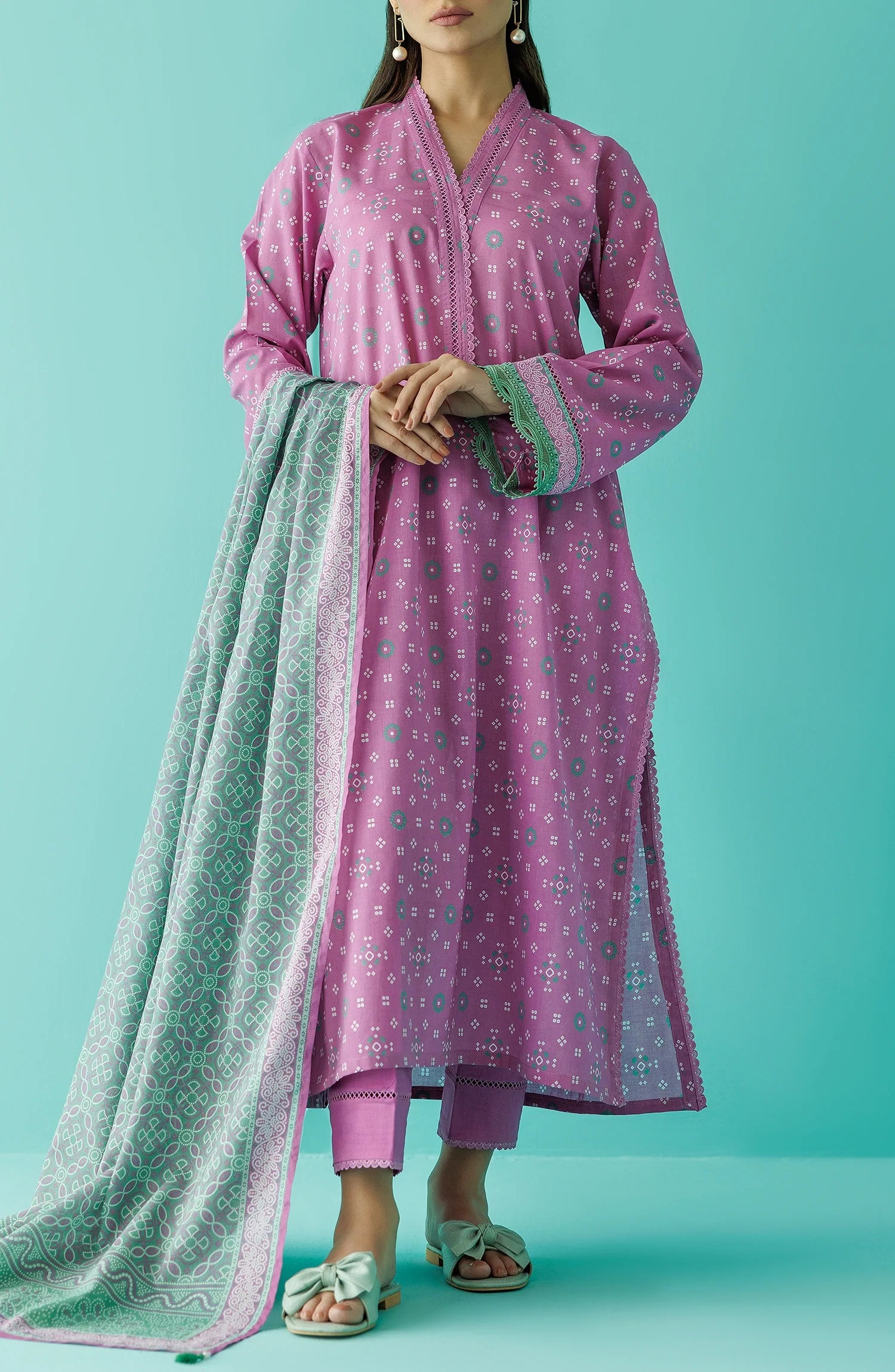 Woman wearing a pink traditional outfit with a green dupatta with a plain traditional trouser. Unstitched Printed Lawn Shirt Dupatta & Pant - 3 Piece Suits - OTL-20015