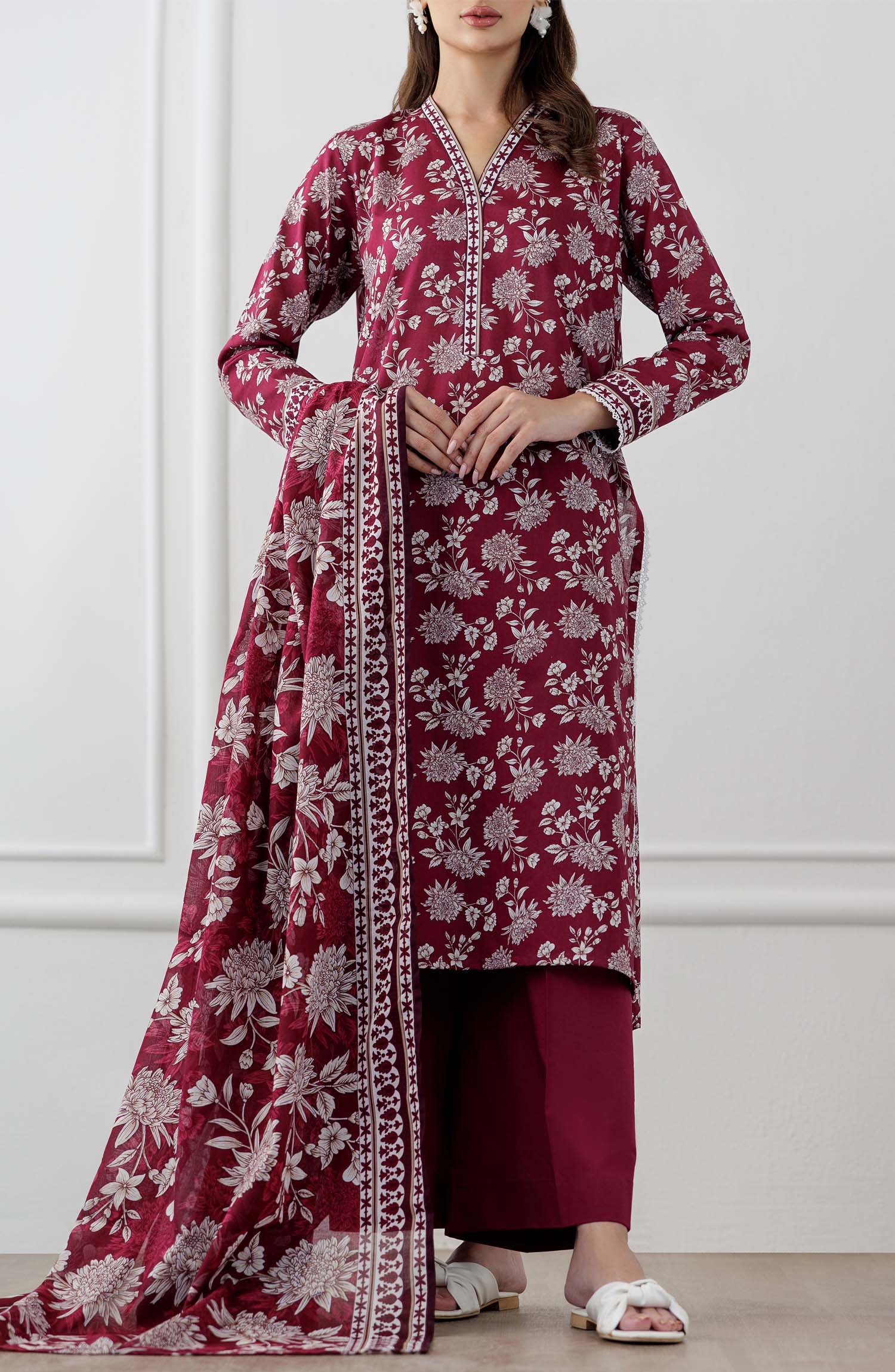 UNSTITCHED Printed Lawn Shirt Dupatta & Pant - 3 Piece Suits - OTL-25-060. Woman wearing a maroon floral dress with white patterns with printed dupatta on a plain trouser.
